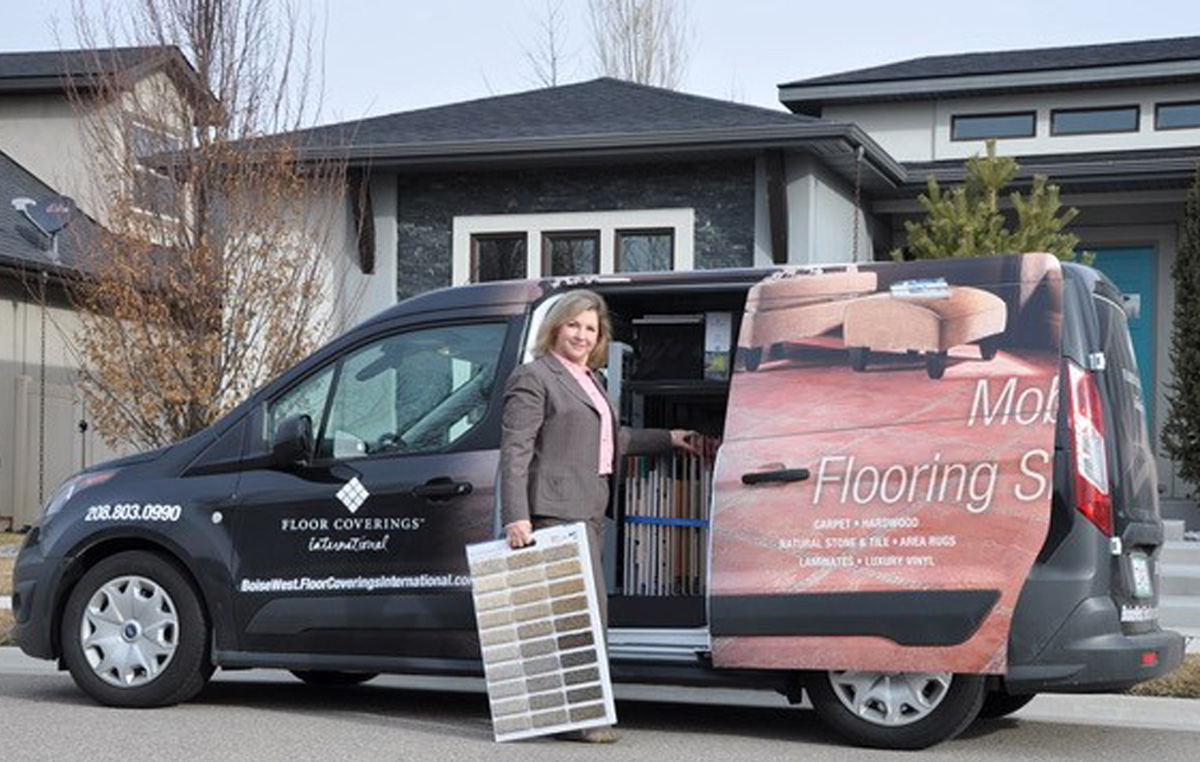 Floor Coverings International Franchise Owner in front of van